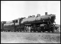 NP 1728  new  Livingston  cy  Caruso  Orig BW?room  WRM New W-3  2-8-2  Engineer, fireman and ? on ground  Mechanical power reverse  Old style electric headlight  No lettering on tender  Numbers on cab covered with glass  Speculation: this engine was to be used in helper service  Copy negative of a Caruso photo  Warren R. McGee's role may have been that of making the copy and trading it to Nixon  Right side view