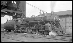 NYC 3315  Chicago  9/34 RF view of New York Central 4-6-2 under coal dock, with water column and sand hose