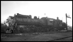 2-8-2 No.26 taking water, Note air tanks between bell and sand dome.