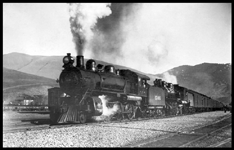 NP #1-1306-284 leavg Missoula about 1904  cy  Beebe Left front tight angle view of entire train, 4-6-0 class S-3 1306 [Schenectady, 1901] helping and road engine 4-6-2 class Q 284 [Alco, 1903, later renum 2084]  This is an early North Coast Limited  Note the older lettering style, with the engine number in large numerals on the tender of 1306