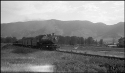 NP 217-1529  Near Brisbin  9/12/40  This view is of NP's passenger train from Livingston MT to the entrance to Yellowstone National Park at Gardiner  MT  The third car back, with the big windows, is an open air car built specifically for service in the 