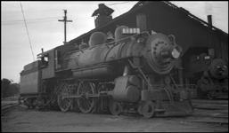 SP 1458  E23  Cook 1900  RWB, whose identity is unknown to the cataloger  This is a negative for which Nixon must have traded  Unlike other negs obtained from RWB, this one has no information as to date and place, but the engine house looks to the cataloger like one at Sausalito, and the next photo in the numbering series is an RWB shot at Sausalito, so the probability is that the location is Sausalito and the date is 1938  Sausalito is the southern terminus of the Northwestern Pacific Railroad, which was at this time an SP subsidiary and which often leased older and smaller SP power