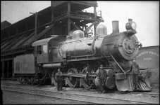 NP 1356,  10 Wheeler Vauclain locomotive, at Spokane, WA.  Crew poses with locomotive in front of coal dock.