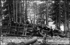 NP 769 Class C-6, 4-4-0 locomotive derailed on  its side at what is described as Como, Montana.  Looks like this accident may have been in the area of a logging operation.