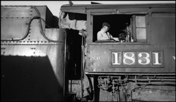 Road Foreman Sullivan in Cab of NP 1831, Class W-3 after Fireman P A Normandeau had been killed on bridge 210 near Donlan