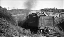 View of helper pushing NP Train 1st No.1 with all passenger cars inside tunnel.  Head end power NP 2662, Class A-3, conductor Weir, Engr Rugamer and on Helper engine NP 2246, Class Q-5, was Engr Pfohl handling 12 cars, in Bozeman tunnel just west of Muir.
