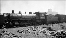 NP Class Q no. 2084 is less than one month away from being scrapped at South Tacoma, where this photograph was made on May 16, 1946. Alco built this 4-6-2 Pacific type locomotive in December 1902 as no. 284. It was renumbered 2084 in 1915. This and other Class Q engines had piston valves and inside Stephenson valve gear, along with a 