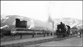 NP Train No. 603 powered by Electro Motive 103, experimental diesel electric locomotive arrives Missoula on test run from Northtown to Auburn. NP Dynamometer Car behind locomotive on the left and NP train X1850W on the right with NP 1850, Class W-5 steam locomotive .
