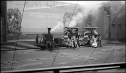 Tom Thumb locomotive and coaches crossing stage at 