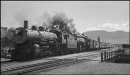 NP Train No. 4 arrives in Livingston with NP 2180, Class Q-4, and NP 1912, Class W-2 locomotives.