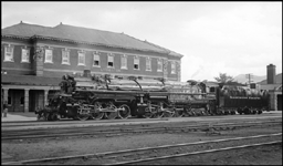 Fresh from the shops and looking like the better part of a million dollars, one of the Northern Pacific's 12 Yellowstone engines, among the largest locomotives in the world is showing off its new coat of paint at the passenger depot.  The engine is a 1930 product of Baldwin.