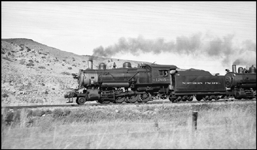 An engine extra, a movement of locomotives to where they were needed, was often an easy assignment which allowed the fireman some time to sit down.    Such is the case on Engine Extra 1205 West.  The 2-8-0 is running with an 0-6-0 behind.  NP always ran switchers and most movements to and from the shops as light engine moves with a two man crew.