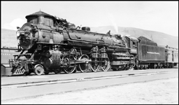 NP 2606, Class A stopped with passenger train for station work at Missoula.