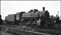 USSR 3836 , 2-10-0 steam locomotive in Portland, OR boarded up for possible shipping to USSR, w/o tender.