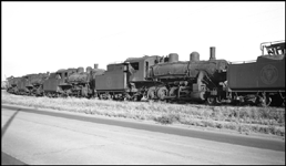 Scrapped Spokane International Railroad steam locomotives at Spokane, WA.