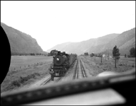 Cab view of west bound NP 1592, a 2-8-2 Mikado Class W, with an extra freight train at Weeksville, Montana.