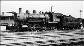 NP 2-6-2 Prairie no. 2454 with high switcher headlight works the yard at Jamestown, ND 