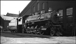 NP 1648, Class W 2-8-2 Light Mikado cooling her heels in the shade behind the South Tacoma Back Shops.  She was built in March 1907, switched from coal to oil-burning in May 1929, and dismantled in December 1954 at South Tacoma.  Fifty of this class of locomotive were still listed on the roster in 1956.