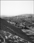 On this summer day in July 1951 near Spokane, Advanced #2, the North Coast Limited is steaming east behind Class Q-6 4-6-2 2248 carrying perishable produce from the Yakima Valley or fresh Salmon from the Pacific Northwest to Eastern markets.  After November 16, 1952, this train will be called the Mainstreeter.