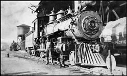 Engineer Crewdson and a dog with NP 691, a 4-4-0 American Std Class B-3, at Ellensburg, Washington. The locomotive is former NP 4.