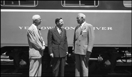 Unknown person with R. S. Macfarlane and Gov. J. Hugo Aronson at dedication of NP 1382 at Helena, MT.