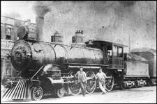 NP 351, Class E-3 locomotive at Spokane, with crew leaning against side rods. Former Number NP  621.