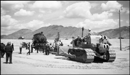 Moving NP 25, Class Y-1, at Butte, into display position.  Cat tractor being used to position panel rail which is being used to advance locomotives route to display location.