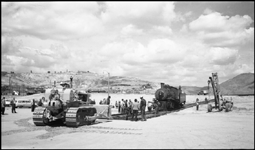 Moving NP 25, Class Y-1, at Butte, into display position.  Cat tractor being used to position panel rail which is being used to advance locomotives route to display location.