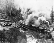 NP passenger train no. 10 roars over the small trestle at tiny Vollmer, ID (now Troy) behind shiny 4-4-0 no. 375, engineer Gus Bowman, in 1902.