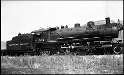 The standard early NP freight power, a W class Mikado, handles an extra on track shared by the Northern Pacific and the legendary Camas Prairie.    This Mike was built by Alco in April 1904.  It would be NP freight power for 48 and a half years.