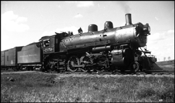 Northern Pacific often used 4-6-2's, normally passenger power, for lighter freight duties.  This one is on a Faro to Streeter freight run on the Fargo and Southwestern branch.  The engine is a Q-4, built by Baldwin in 1909, scrapped  January, 1948