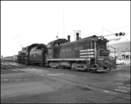 CBQ 4960, a 2-8-2 steam locomotive and NP DE 138 an EMD SW 1200 at Billings, Montana.