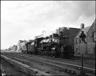 CBQ 4960, a 2-8-2 steam locomotive and NP DE 138 an EMD SW 1200 at Billings, Montana.