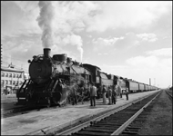 CBQ 4960, a 2-8-2 steam locomotive and a diesel helper with passenger cars at Billings, Montana.