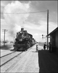 CBQ 4960, a 2-8-2 steam locomotive and a diesel helper with passenger cars at Fromberg, MT.