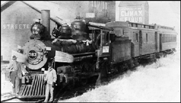 NP 4-4-0 no. 583 leads a two-car passenger train--possibly a July 4 special--at the Streeter, ND, depot.