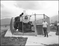 NP 2-8-0 Consolidation no. 25 on display at Butte, with JM standing in front.