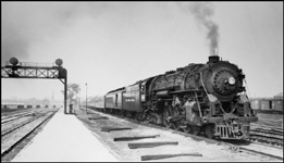 New York Central 5301 heads a passenger train at Englewood, Illinois.
