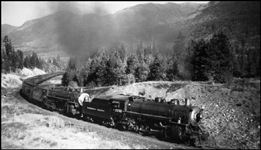 NP 2232 a 4-6-2 Pacific Q-5 and NP 2610 a 4-8-4 Class A Northern are east bound pulling the North Coast Limited east of Schley, MT.  NP 1761, not shown, is helping at the rear.