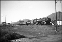 The daily mixed train to Union Pacific's ski resort at Sun Valley is running pretty light today as it passes Hailey, one of the larger towns on the line.  The 2-8-2  was built for the Los Angeles & Salt Lake.