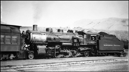 There were 20 W-2 Mikados on the NP, all ALCO products, and all versatile machines.  This  one, 1905 built, is pushing a wartime heavy passenger train out of Missoula.