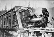 NP 137 later renumbered to NP 970, Class K-1  as seen 43 miles E of Tacoma. Railroad workers posing on train.