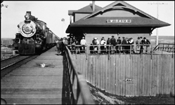 NP 2180, Class Q-4 with passenger train arriving at Wibaux depot.