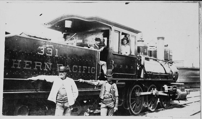 The crew of switch engine, NP 331, poses in the yard at Minneapolis in 1891. This locomotive was later renumbered as 979.