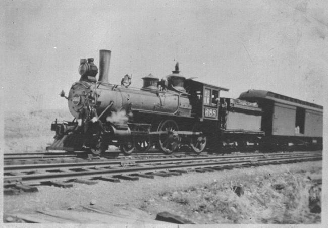 NP 688, Class C-1, in Livingston coupled to baggage car, former number 346