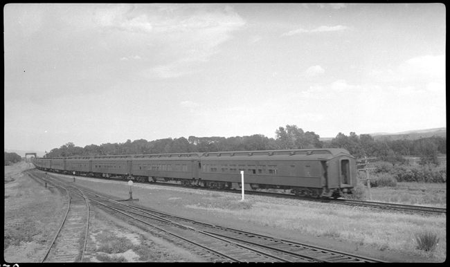 NP 2603, Class A pulling CCC, Civilian Conservation Corp, Special E out of east end of Livingston yards.  18 cars 