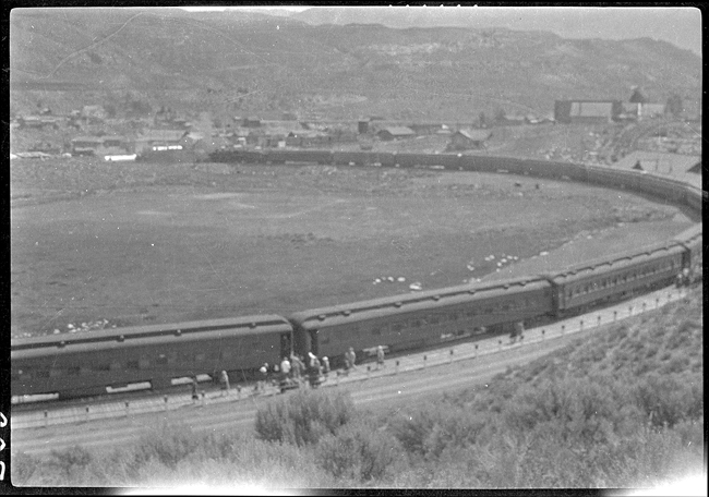 NP 1648, Class W and NP 1548 Class W, with Yellowstone Park Savage Special unloading workers going into Yellowstone Park for summer jobs.  