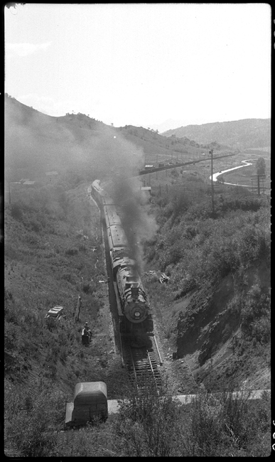 NP 2650, Class A-2 with First No. 1 entering Bozeman Tunnel following the rail train