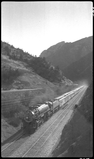 NP 2650, Class A-2 pulling No. 1 toward Bozeman.  Photograph taken from viaduct near Mount Ellis.