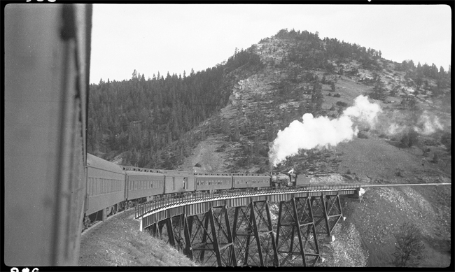 Train No. 3 crossing over Br. No. 18 west of W Skyline. Helper locomotive is NP 1815, Class W-3.